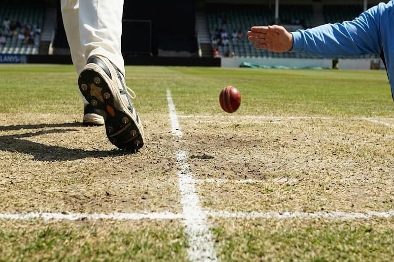 cricket bowler's foot landing just over